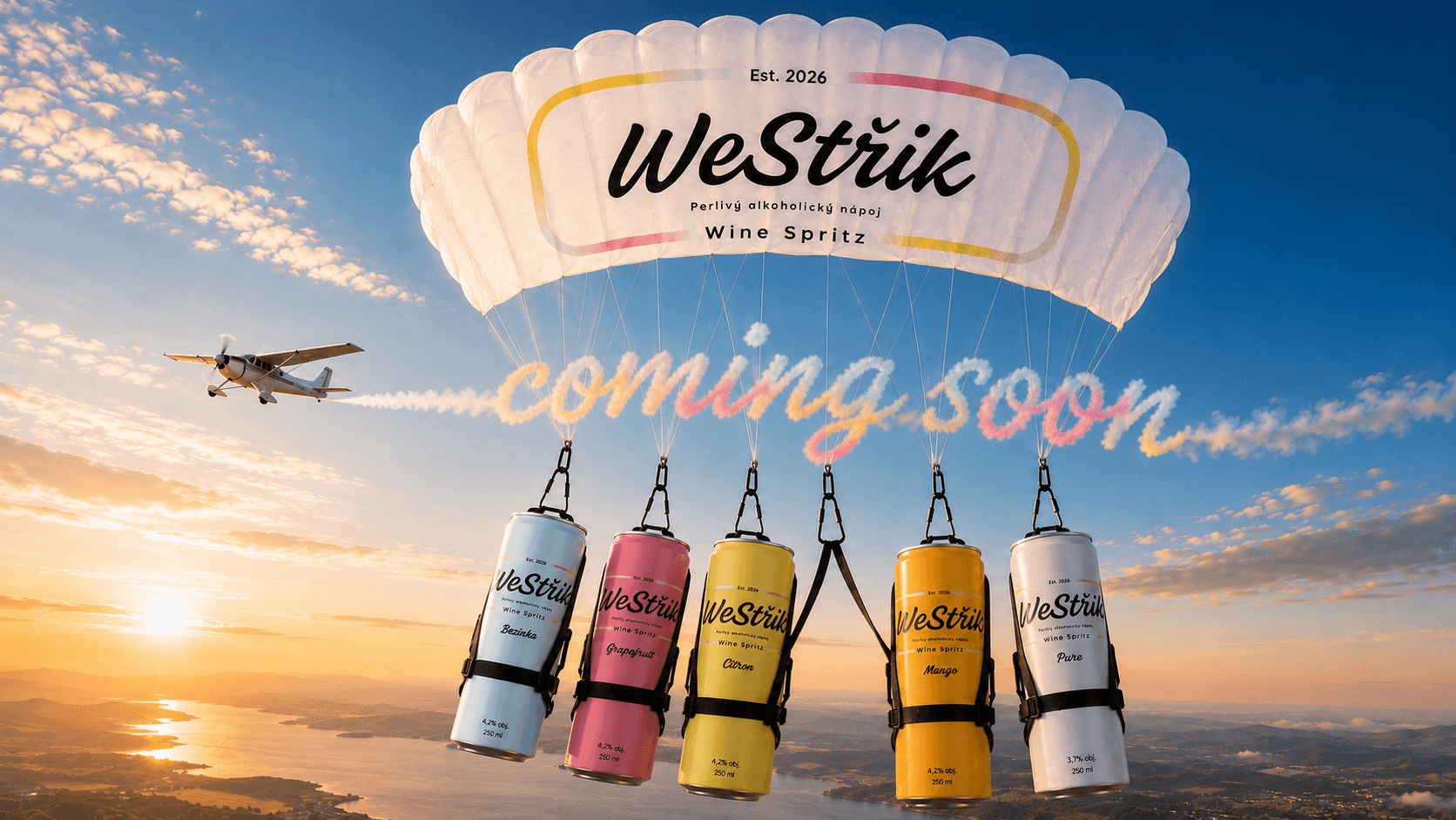Plechovky WeStřik pod padákem při západu slunce se skywriting nápisem coming soon.